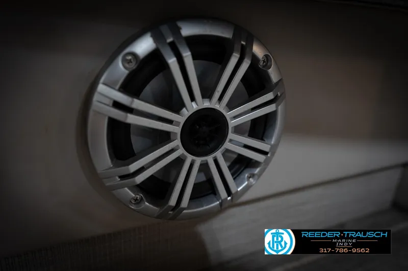 Slide: The Image of 2016 Bennington 2375 RSB boat interior with plush seating and modern controls. - 51