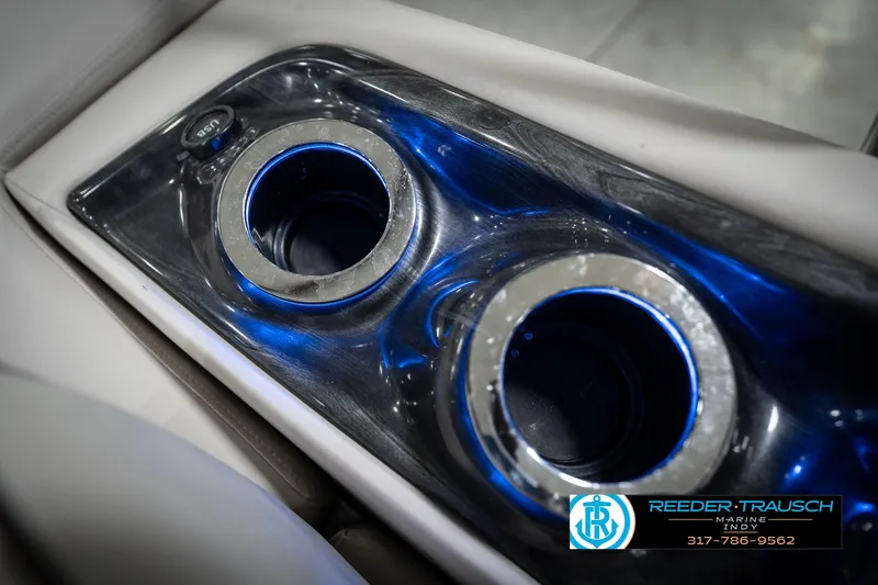 Slide: The Image of Illuminated cup holder on 2016 Bennington 2375 RSB boat, featuring blue LED lighting. - 54
