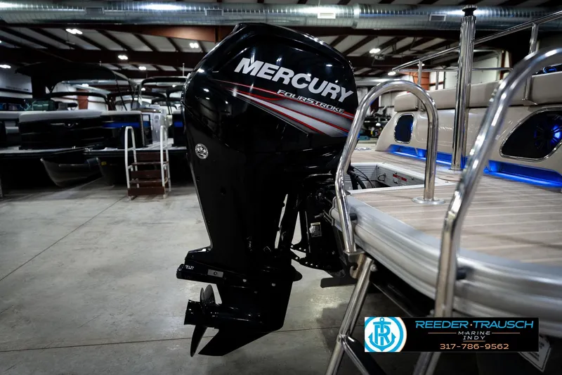 Slide: The Image of 2016 Bennington 2375 RSB with Mercury FourStroke engine in a showroom. - 59