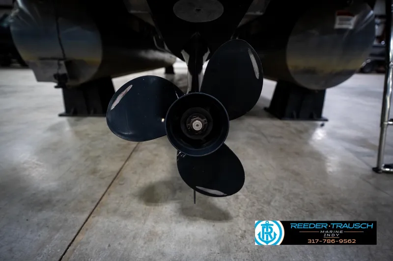 Slide: The Image of Propeller of a 2016 Bennington 2375 RSB pontoon boat in a showroom. - 63