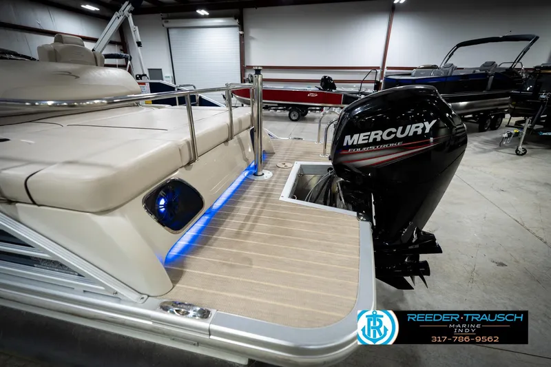 Slide: The Image of 2016 Bennington 2375 RSB pontoon boat with Mercury outboard engine in showroom. - 64