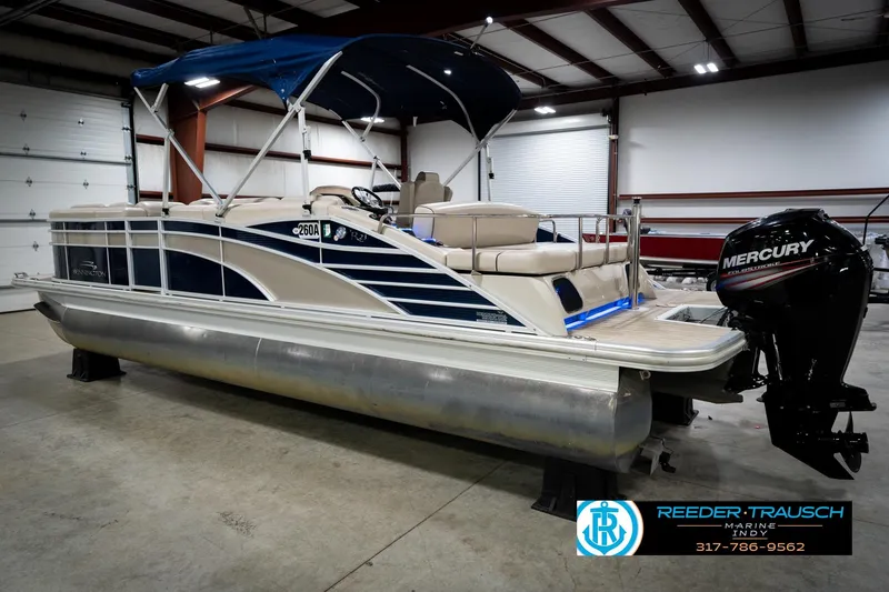 Slide: The Image of 2016 Bennington 2375 RSB pontoon boat with 90 HP engine in showroom. - 9
