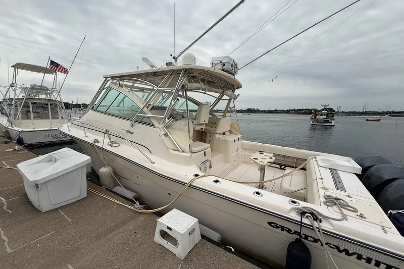 Slide: The Image of 2008 Grady-White Express 360 boat docked at marina, overcast sky. - 1