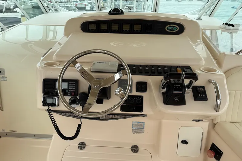 Slide: The Image of 2008 Grady-White Express 360 helm with steering wheel and control panel. - 10