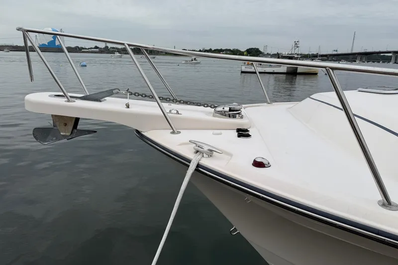 Slide: The Image of 2008 Grady-White Express 360 boat bow with anchor, docked on calm water. - 2