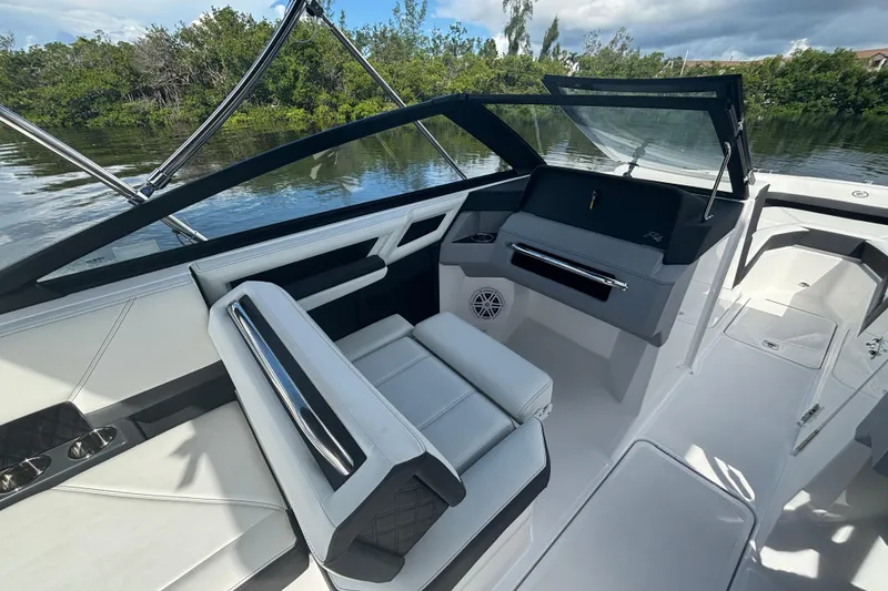 Slide: The Image of 2025 Cobalt R4 Outboard boat interior with sleek seating and modern dashboard design. - 11