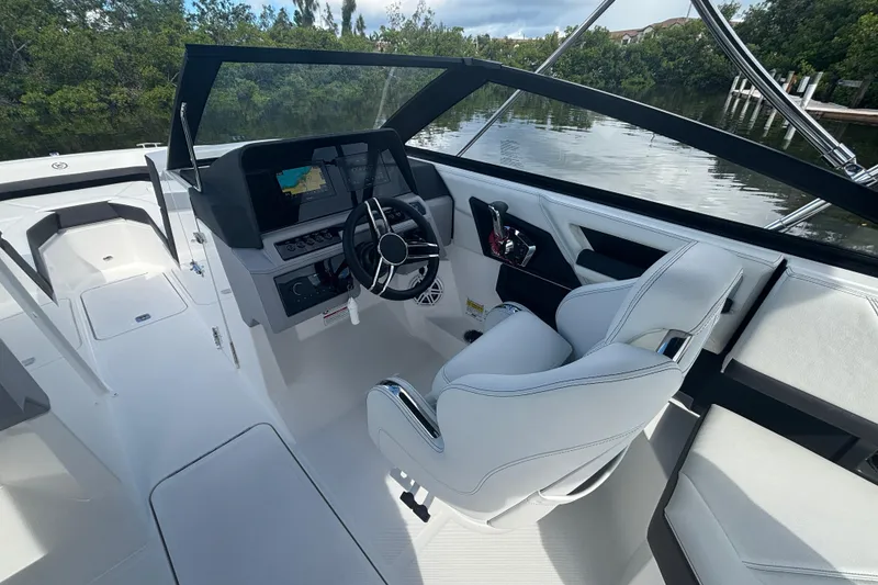 Slide: The Image of 2025 Cobalt R4 Outboard boat interior with modern helm and sleek design. - 12