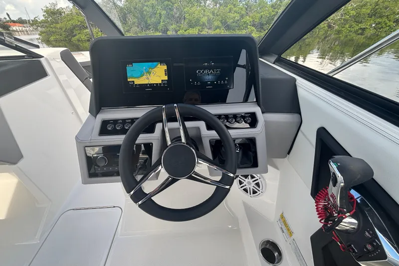 Slide: The Image of 2025 Cobalt R4 Outboard helm with modern controls and navigation displays. - 14