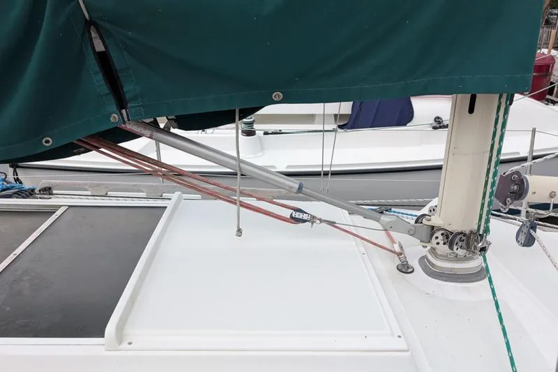 Slide: The Image of Sailboat deck with green cover, Alerion 28, 2001 model, showing rigging details. - 7
