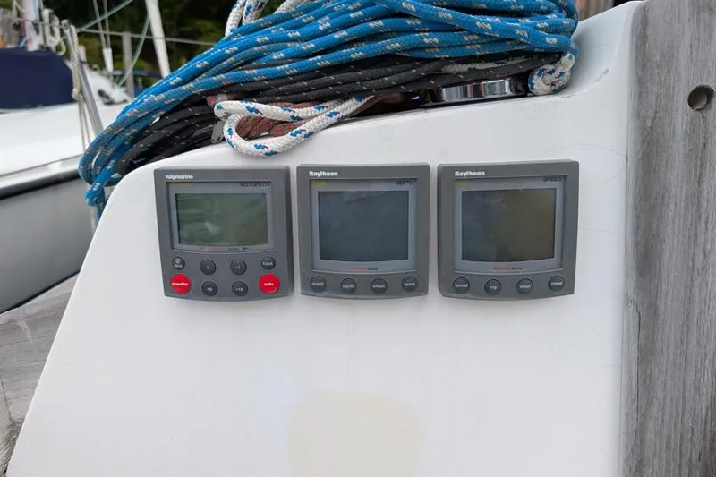 Slide: The Image of Three Raytheon marine instruments on a 2001 Alerion 28 sailboat dashboard. - 8