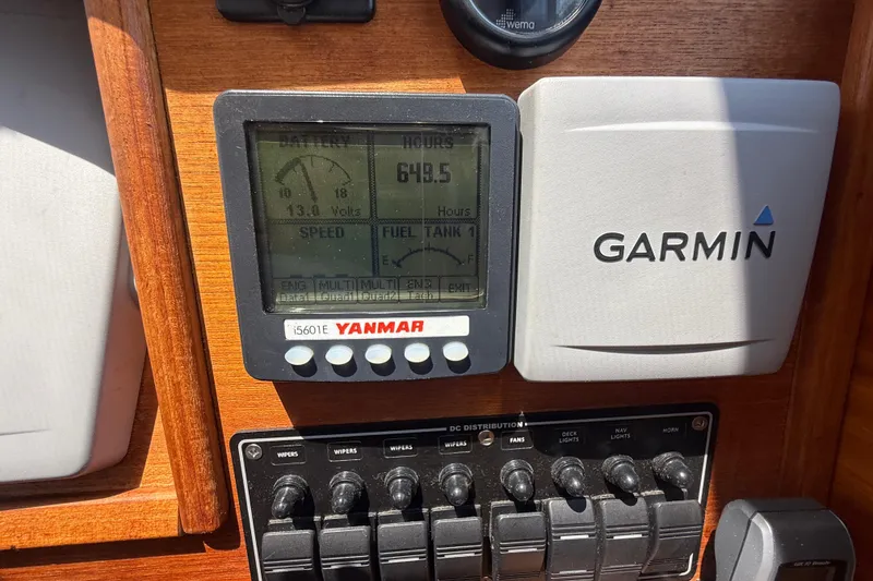 Slide: The Image of Yanmar and Garmin displays on 2013 Ranger Tugs R28 Classic dashboard. - 10