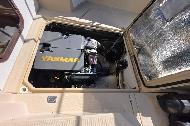 Slide: The Image of 2013 Ranger Tugs R27 Classic engine compartment with Mase generator and wiring. - 26