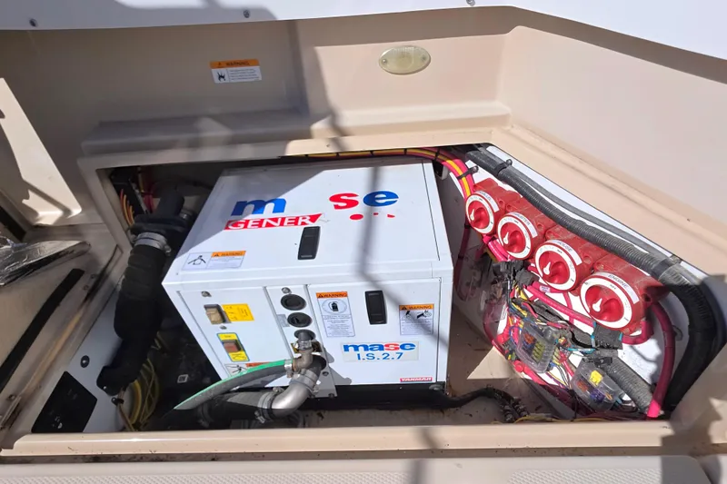 Slide: The Image of Control panel of a 2013 Ranger Tugs R28 Classic, displaying generator hours. - 27