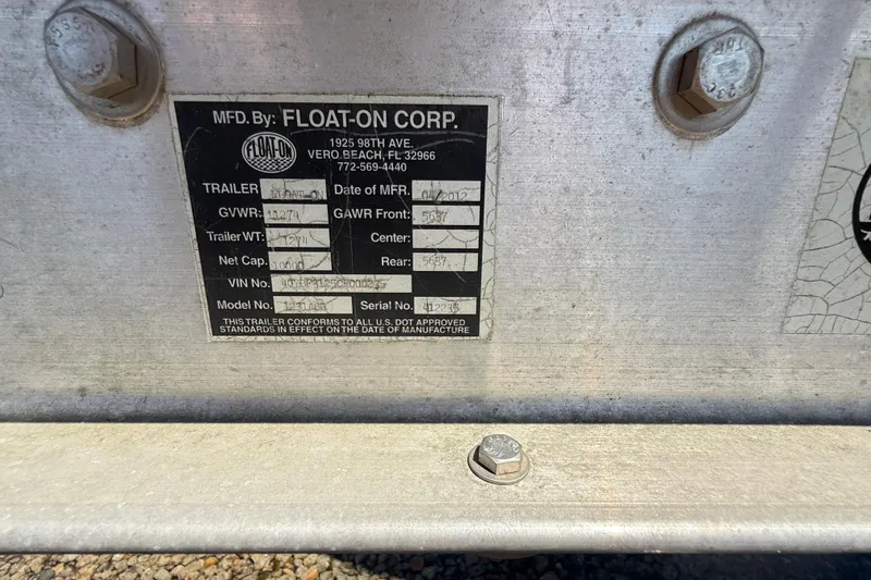 Slide: The Image of Interior of 2013 Ranger Tugs R27 Classic boat with wooden shelves and window view. - 31