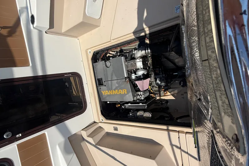 Slide: The Image of Interior of 2013 Ranger Tugs R27 Classic, featuring wood accents and comfortable seating. - 6