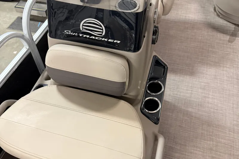 Slide: The Image of Sun Tracker Bass Buggy 16 XL 2021 boat interior with beige seating and cup holders. - 13