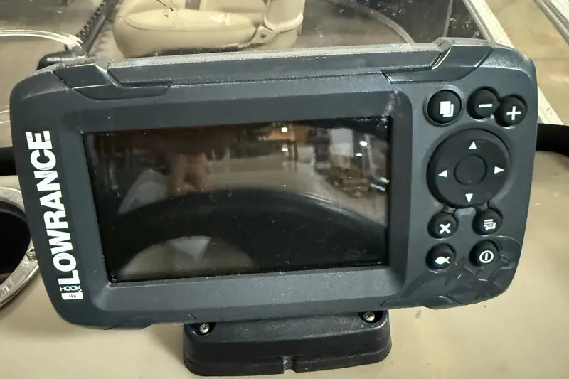 Slide: The Image of Lowrance fish finder on 2021 Sun Tracker Bass Buggy 16 XL boat dashboard. - 14