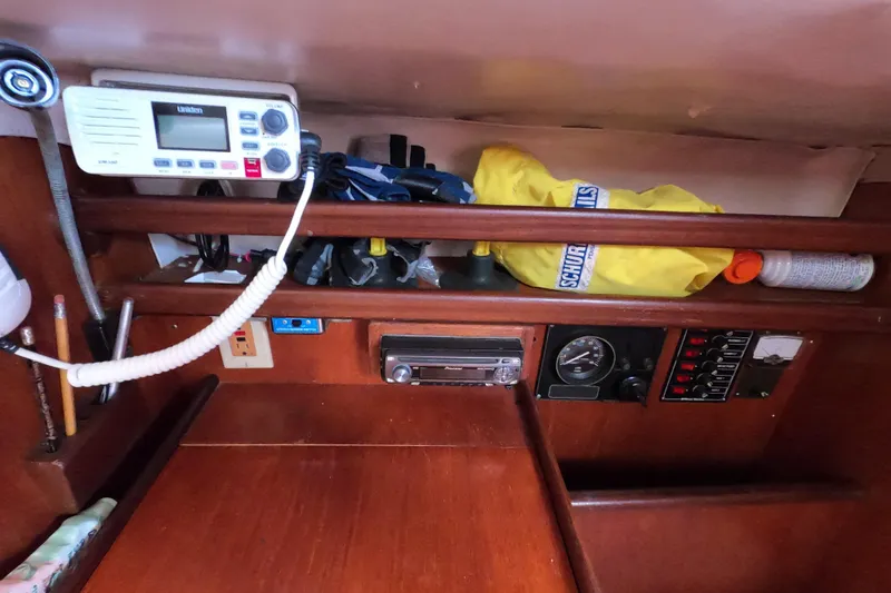 Slide: The Image of Interior of 1985 Beneteau First 29 sailboat with radio and navigation equipment. - 12