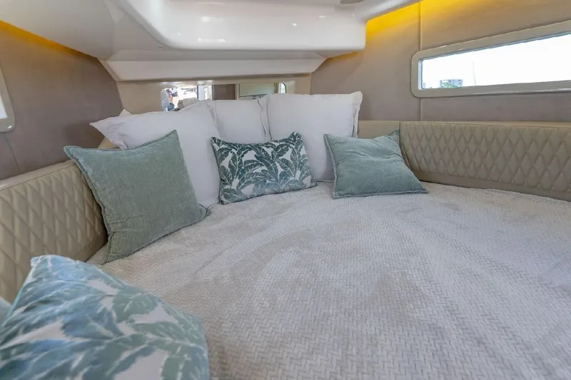 Slide: The Image of Luxurious interior of 2024 Hanover 347 White & Black Edition yacht with plush bedding. - 10