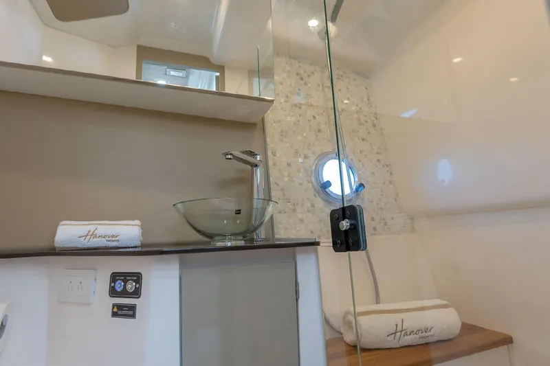 Slide: The Image of Luxurious bathroom in 2024 Hanover 347 White & Black Edition yacht, featuring modern fixtures and elegant design. - 13
