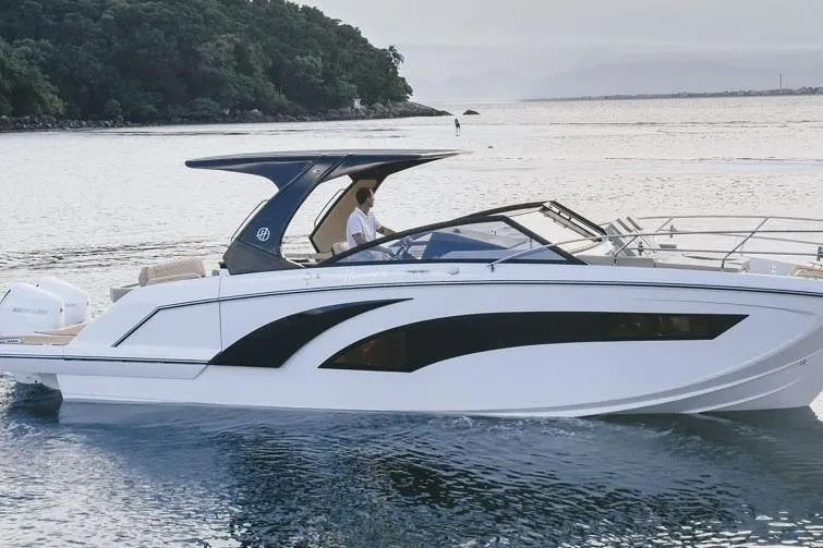 Slide: The Image of 2024 Hanover 347 White & Black Edition boat cruising on serene waters. - 3