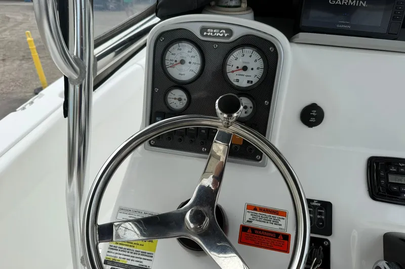 Slide: The Image of Steering console of 2013 Sea Hunt Triton 210 boat with gauges and Garmin display. - 10