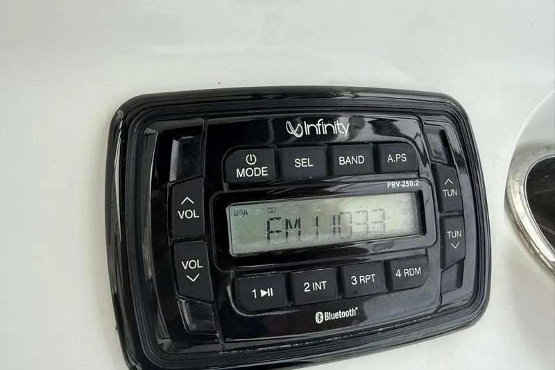 Slide: The Image of Infinity marine stereo system on a 2013 Sea Hunt Triton 210 boat dashboard. - 8