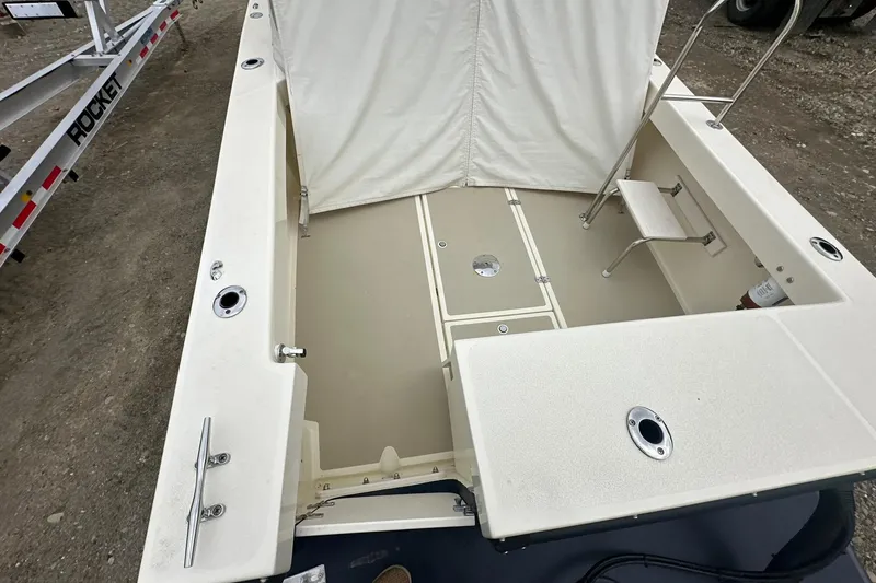 Slide: The Image of 2013 Eastern Explorer 248 boat deck with storage compartments and ladder. - 7