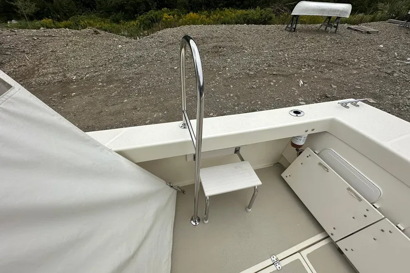 Slide: The Image of 2013 Eastern Explorer 248 boat interior with ladder and storage compartments. - 8