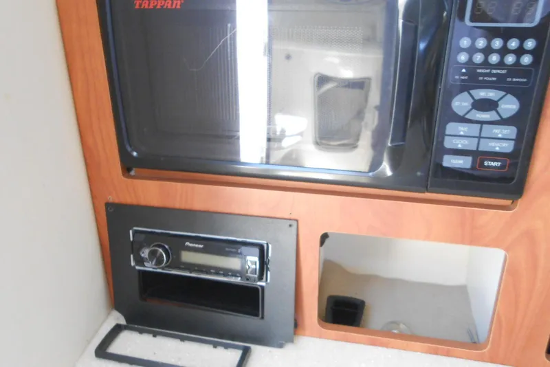 Slide: The Image of Tappan microwave and Pioneer stereo in 2008 Bayliner 300 boat interior. - 16