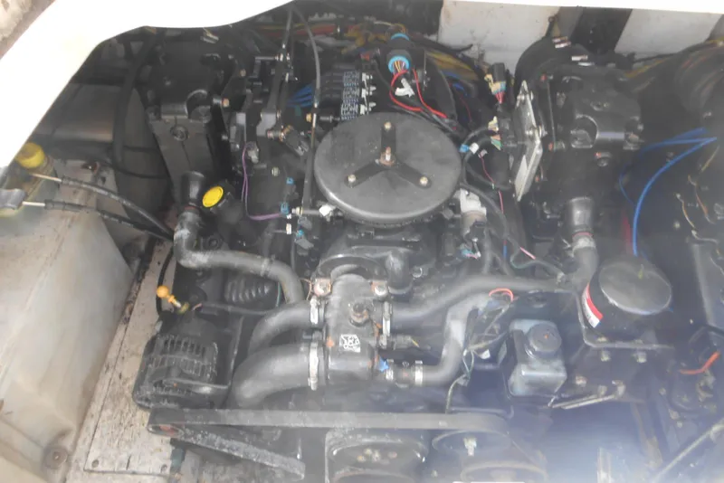 Slide: The Image of Engine compartment of a 2008 Bayliner 300 boat, showcasing mechanical components and wiring. - 19