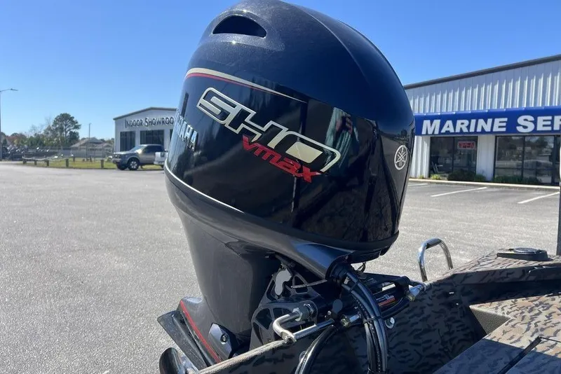 Slide: The Image of 2025 Xpress XP180 boat with Yamaha SHO VMAX outboard motor in a marine service lot. - 10
