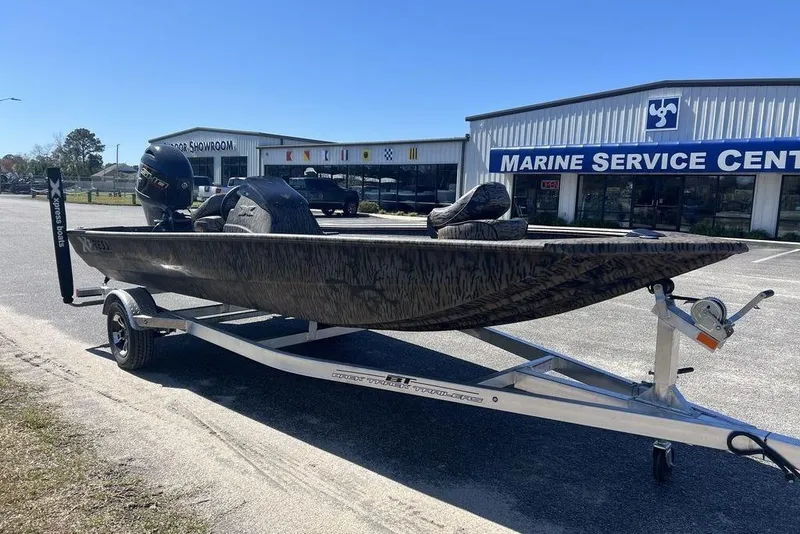Slide: The Image of 2025 Xpress XP180 boat on trailer outside Marine Service Center. - 3