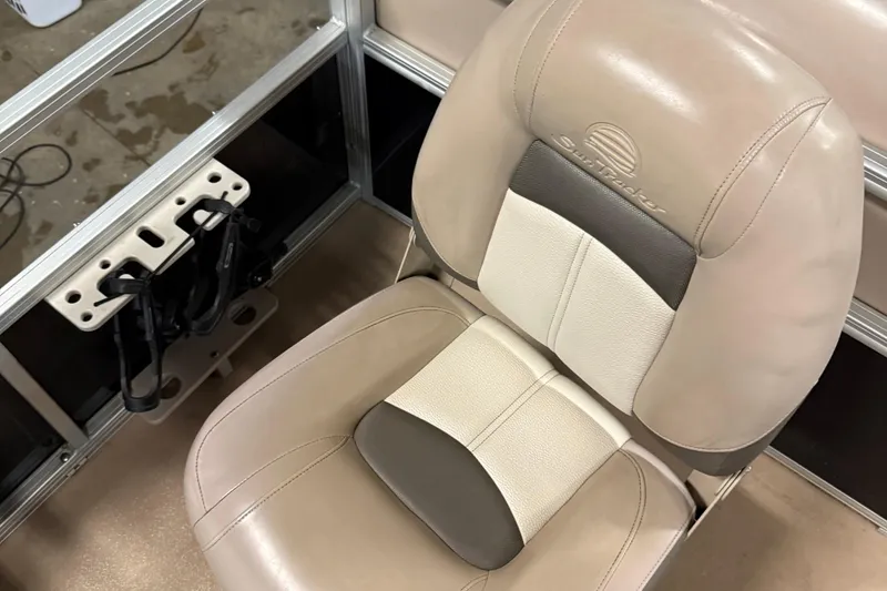 Slide: The Image of 2014 Sun Tracker Fishin' Barge 20 DLX seat with rod holder, beige and gray upholstery. - 15
