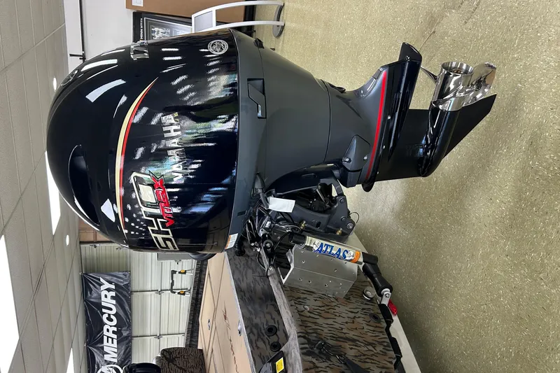 Slide: The Image of 2026 Xpress H20 Bass boat with Yamaha VMAX SHO outboard motor in showroom. - 6