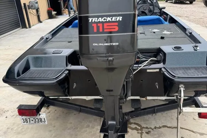 Slide: The Image of 1994 Nitro 170 DC boat with Tracker 115 outboard motor, oil-injected, on a trailer. - 10