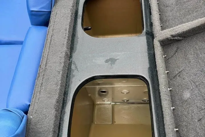 Slide: The Image of Interior view of a 1994 Nitro 170 DC boat showing storage compartments and seating. - 16