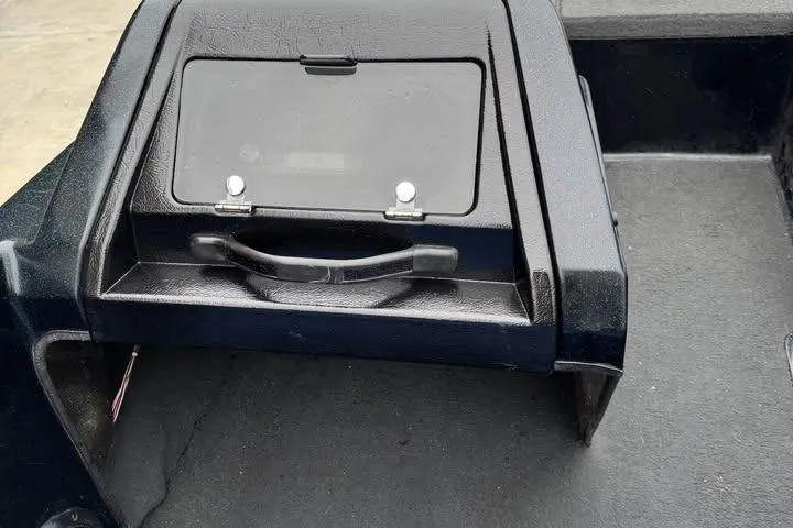 Slide: The Image of Dashboard of a 1994 Nitro 170 DC boat with storage compartment. - 17
