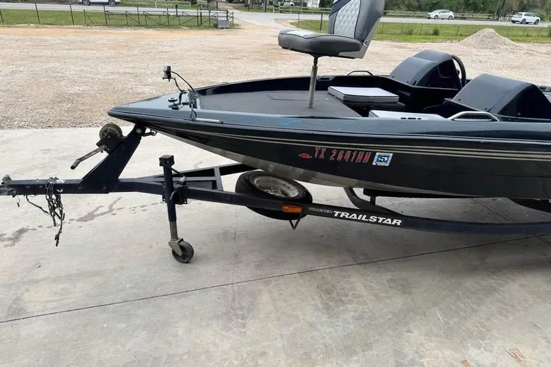 Slide: The Image of 1994 Nitro 170 DC boat on Trailstar trailer, parked outdoors. - 4