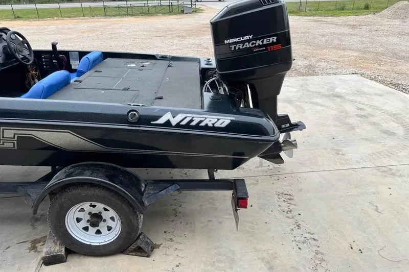 Slide: The Image of 1994 Nitro 170 DC boat with Mercury Tracker 115 engine on trailer. - 8