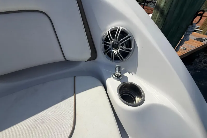 Slide: The Image of 2014 Yamaha Boats 242 Limited S interior with speaker and cup holder. - 10