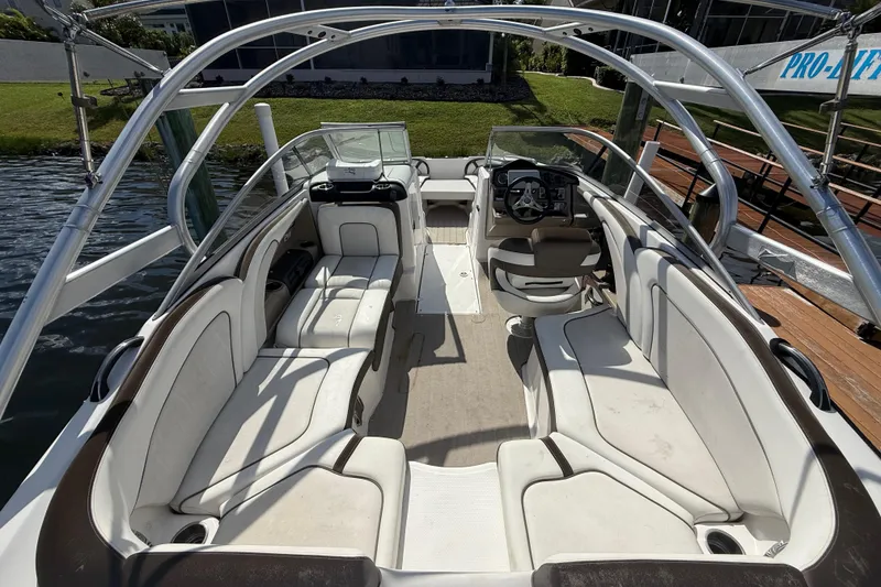 Slide: The Image of 2014 Yamaha Boats 242 Limited S interior with spacious seating and sleek design. - 11