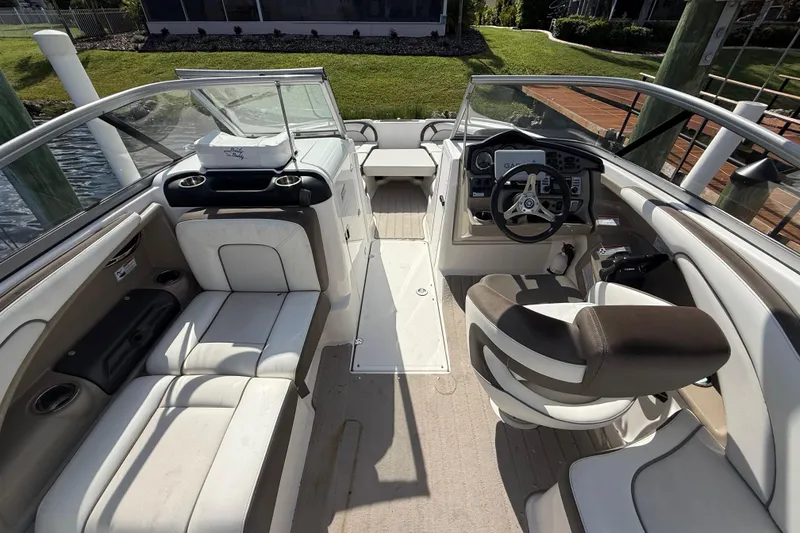 Slide: The Image of 2014 Yamaha Boats 242 Limited S interior with seating and steering console. - 13