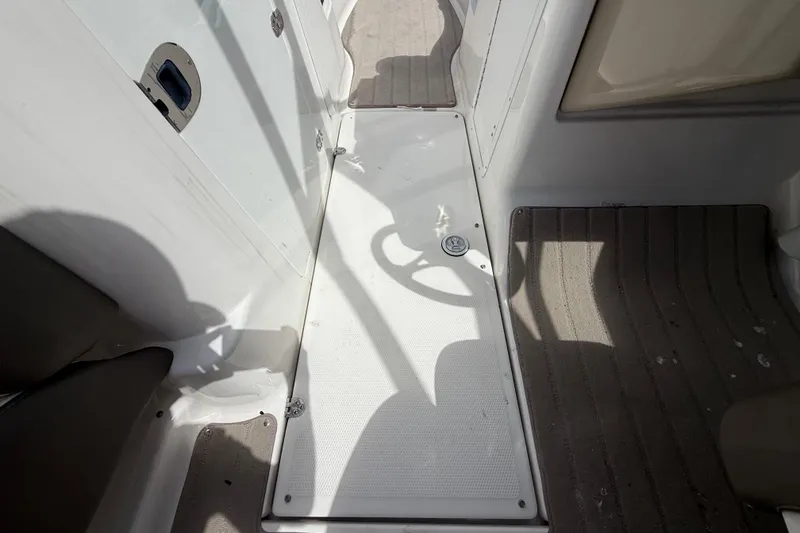 Slide: The Image of 2014 Yamaha Boats 242 Limited S interior walkway with textured flooring. - 20