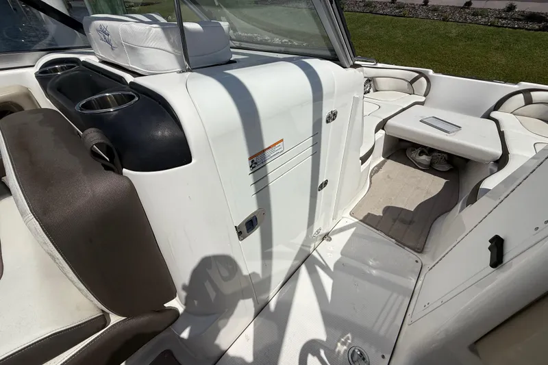 Slide: The Image of 2014 Yamaha Boats 242 Limited S interior with seating and cup holders. - 23