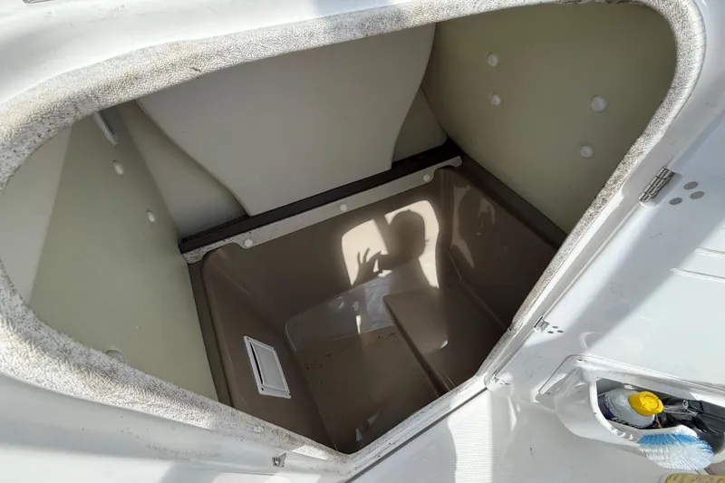 Slide: The Image of Open storage compartment on a 2014 Yamaha Boats 242 Limited S. - 24