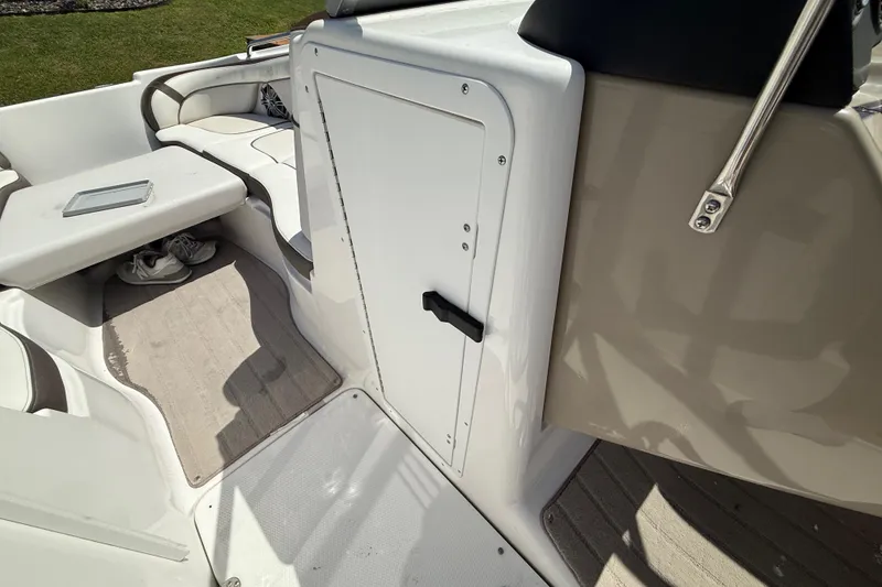 Slide: The Image of 2014 Yamaha Boats 242 Limited S interior with seating and storage compartment. - 26