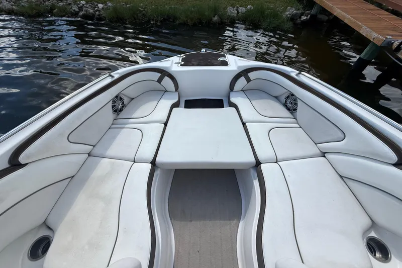 Slide: The Image of Interior of 2014 Yamaha Boats 242 Limited S with white seating and table. - 32