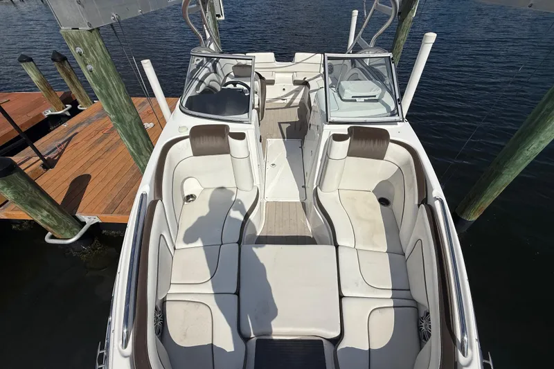 Slide: The Image of 2014 Yamaha Boats 242 Limited S interior with spacious seating at dock. - 35