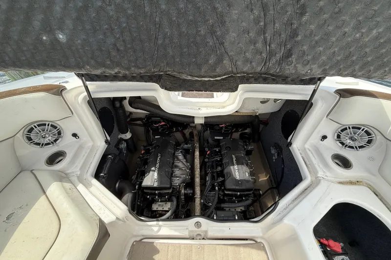 Slide: The Image of 2014 Yamaha Boats 242 Limited S engine compartment with twin high output engines. - 48